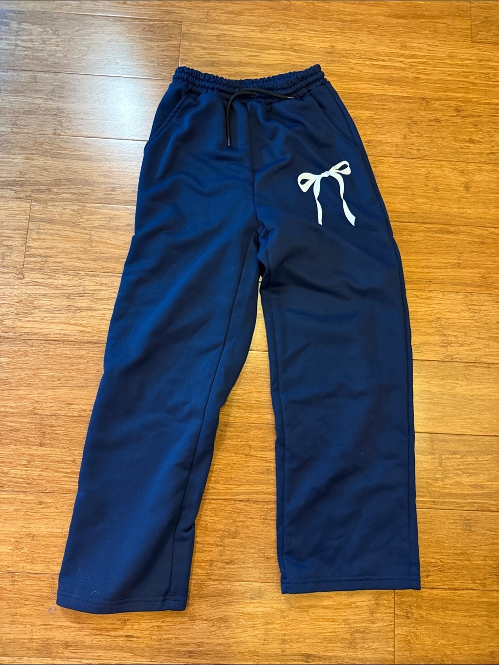 Girls navy sweatpants with white bow detail on left thigh size 12 NWOT